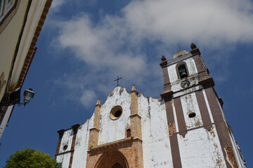 Old church, under a blue sky and a few clouds