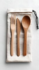 Wooden fork and spoon in fabric cutlery pouch