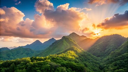 Lush green mountains bathed in golden sunlight at sunrise with dramatic clouds