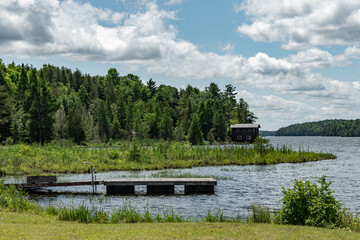 Lake shoreline with a dock on a windy day