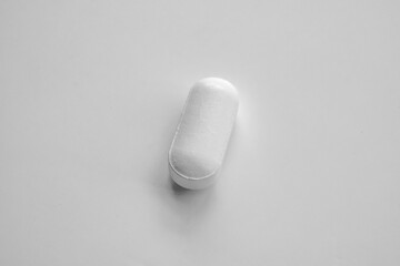 White medicine pill tablet on white background