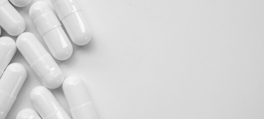 White medicine pills capsule on white background