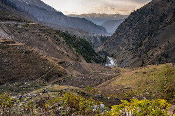 Terraced Valley with Mountain Stream and Sunset Glow