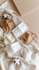 Three face masks comfortably resting on a bed with soft desert hues and gentle textures