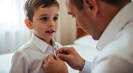 Father helping his young son button up his white dress shirt a warm bonding moment during a special occasion preparation