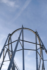 A roller coaster with a large white structure in the middle