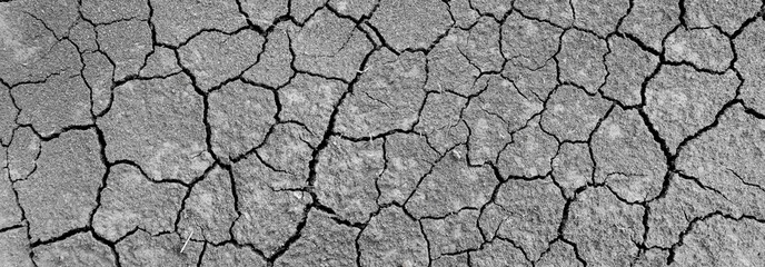Wall texture soil dry crack pattern of drought lack of water of nature brown old broken background.
