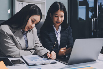 Fototapeta premium Accounting company provide finance and taxation planning for profitable cash flow, Auditor and accountant team working in office, analyze financial data and accounting record with calculator.Insight