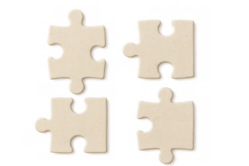 Four separated puzzle pieces on a transparent background represent problem-solving, teamwork, and strategy