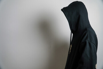 Person in Black Hoodie with Head Down