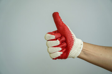 thumbs up with work gloves