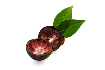 An empty mangosteen peel, showcasing its dark outer and reddish-purple inner texture, accompanied...