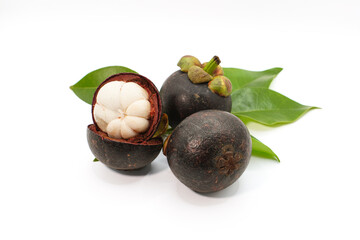 Fresh mangosteens, one perfectly peeled to reveal its pristine white pulp, arranged with green leaves on a white background.
