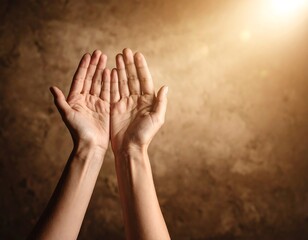 Hands raised in prayer against a textured background