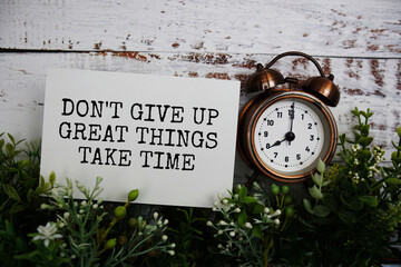 Don't give up great things take time text message motivational and inspiration quote top view on...