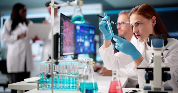 Multiracial Doctors In Laboratory Analyzing Data - Powered by Adobe