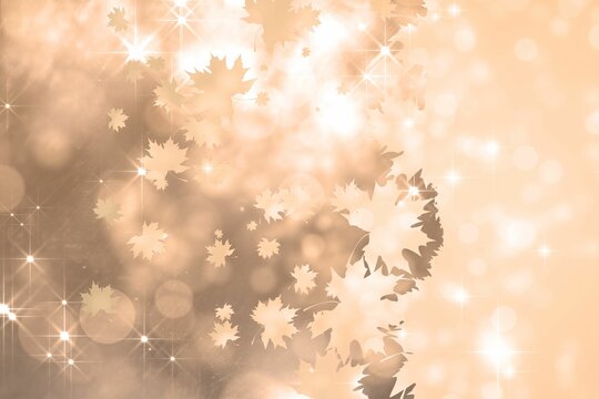 Abstract flat art showing maple leaf silhouettes drifting into warm gradient with bokeh sparkles