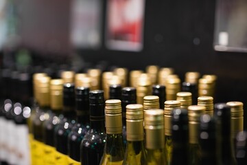 Wine bottles arranged at supermarket