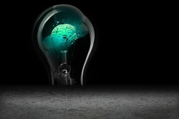 Glowing brain in light bulb
