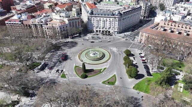 Neptuno Fountain In Madrid Spain. Aerial View Of A Bustling Downtown Cityscape With Modern Buildings. Business Clouds Sky Downtown Cityscape. Business Backgrounds Panning Wide. Madrid Spain.