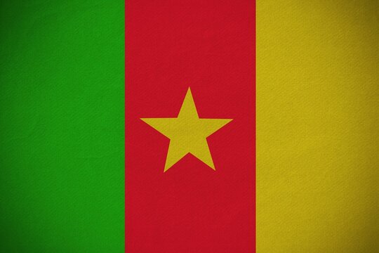 Fototapeta Cameroon national flag is showing on textured fabric with green red yellow stripes and yellow star