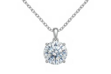 Studio shot of a silver chain holding a sparkling round cut diamond pendant on transparent background