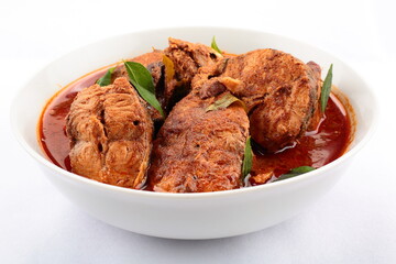 Bowl of spicy Kerala fish curry. Indian seafood recipes.