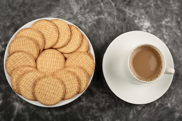 Top view- fresh baked biscuits and milk tea , breakfast table concepts.