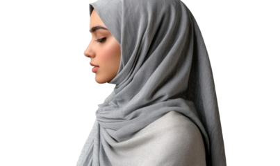 Elegant Profile of a Young Woman Wearing a Soft Gray Hijab, Capturing Grace and Beauty in Traditional Islamic Fashion and Modesty in Contemporary Portraiture