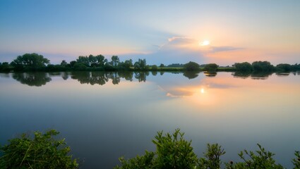 Obraz premium Tranquil Sunset Over Still Waters Reflecting Trees and Sky a Serene and Peaceful Nature Scene