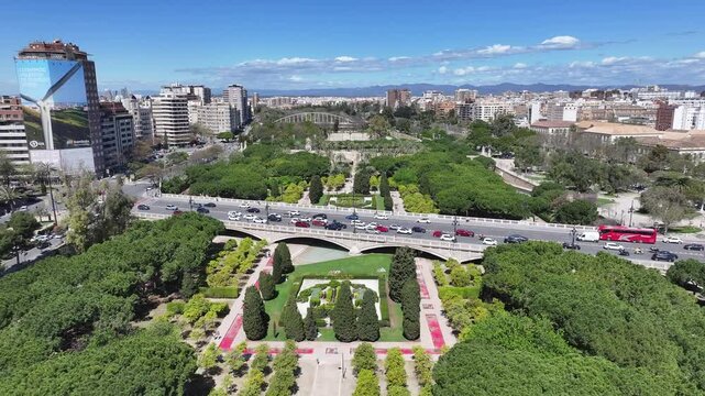 Turia Gardens In Valencia Valence Community Spain. Aerial View Of A Bustling City With High-Rise Buildings And Traffic. Town Sky Backgrounds Urban. Backgrounds Downtown Panning Wide.
