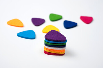 Felt picks in different colors for playing the ukulele or other string instruments.