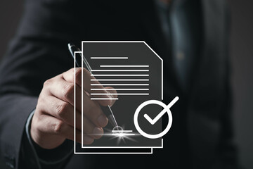 A businessman signs a document, symbolizing approval and professionalism with a focus on legal or...