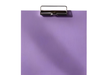 Blank purple note paper with metal clip for creative display.