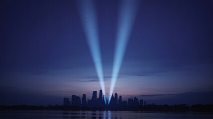 Tribute in Light illuminating the City skyline at dusk A 911 Memorial Display