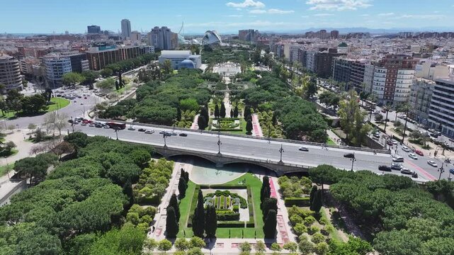Turia Gardens In Valencia Valence Community Spain. Amazing Skysrapers And Traffic On Street Viewed From Above. Town Clouds Sky Backgrounds Urban. Exterior Backgrounds Panoramic City.