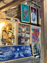 Colorful Traditional and Contemporary Paintings Displayed in a Bamboo Art Gallery
