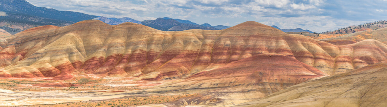 Colorful red painted hills caused by erosion, climate changes and volcanic activity in Eastern Oregon.