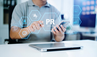 PR, Public relations concept. hands using laptop and tablet with public relations icon