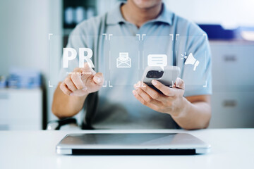 PR, Public relations concept. hands using laptop and tablet with public relations icon