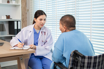 Female doctor consulting senior patient across table, pointing at laptop screen while discussing treatment plan in professional and friendly healthcare environment, illness, hospitality.