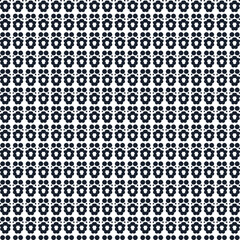 Solid and cut dots or small circles form a pattern with holes.