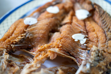 Deep-fried Sea bass with Fish Sauce served on plate