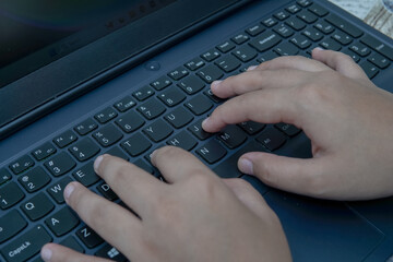 Realistic photograph of hands typing on keyboard a modern digital scene for tech blogs business...