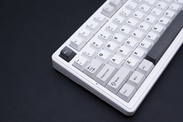 Minimalist white compact mechanical keyboard product shot for tech blogs e-commerce and modern...