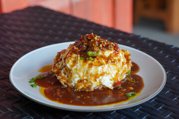 Pontianak Egg Rice, Indonesia, captured on June 29, 2025. A popular street food dish featuring...