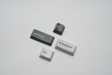 Minimalist photographic still life of essential keyboard keycaps for tech concepts or abstract...