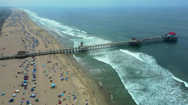 Static 60fps Drone shot of Huntington Beach crowd on the 4th of July