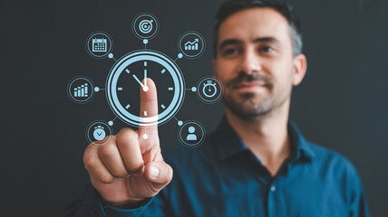 Man touching a digital clock interface with icons for time management and productivity