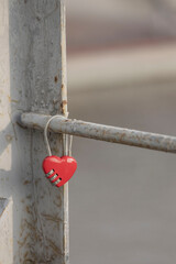 The red heart hanging on the bridge